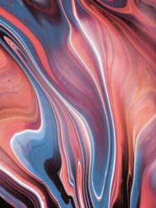 Dynamic abstract painting with vivid swirling colors and fluid design.